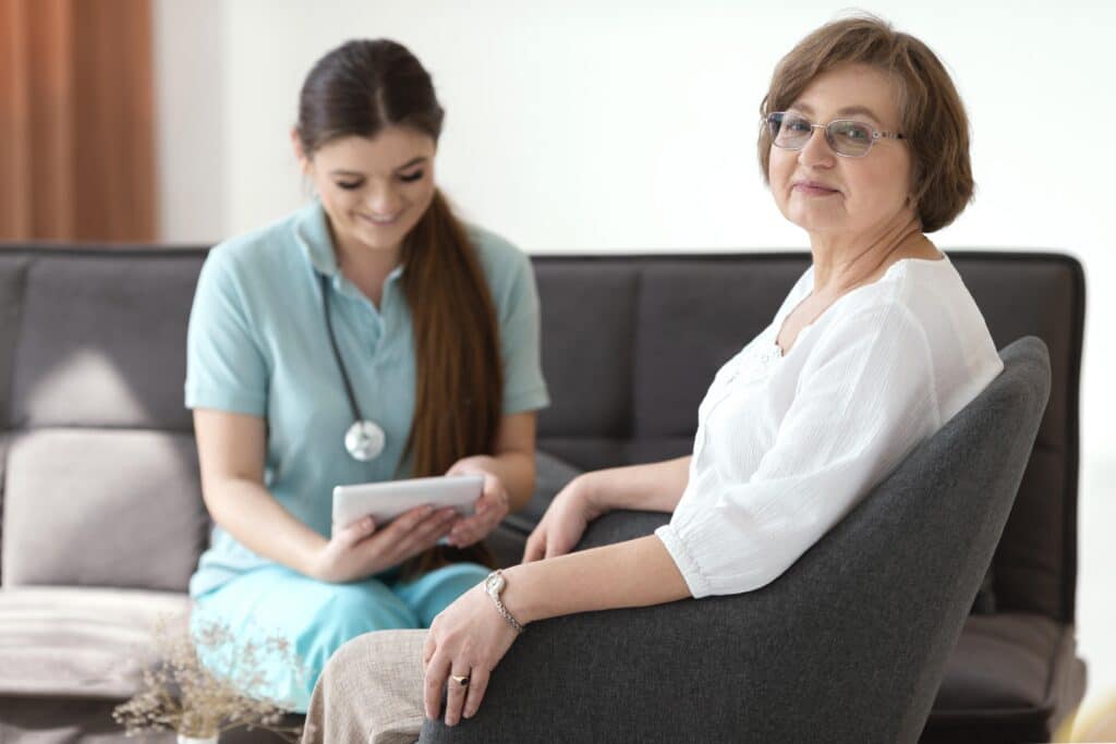 Specialist cancer nurse preparing to deliver IV therapy at a patient's home in London