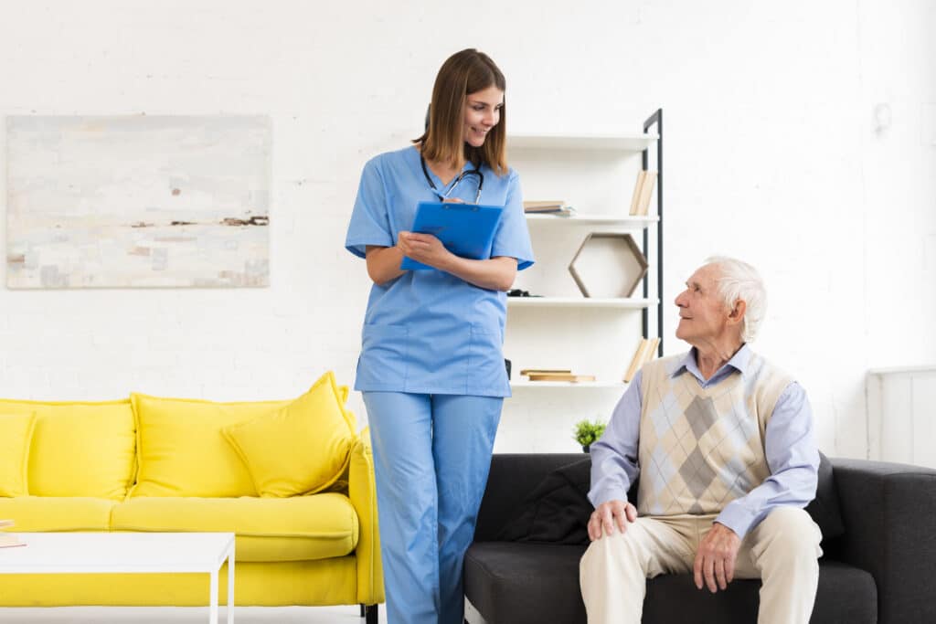 Cancer nurse preparing an IV infusion at a patient's home in Mayfair